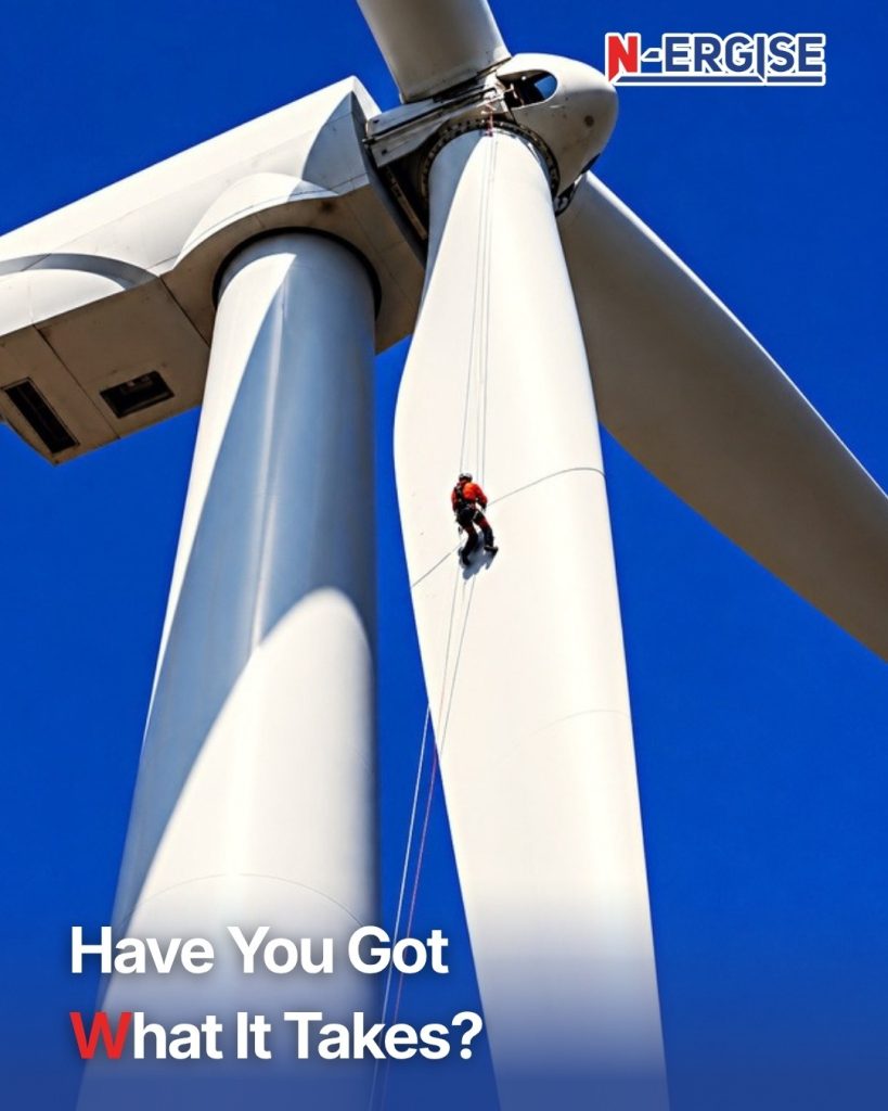 N-ERGISE Rope Access technician descending a Wind Turbine blade on ropes against a deep blue sky, with the headline Have You Got What It Takes?